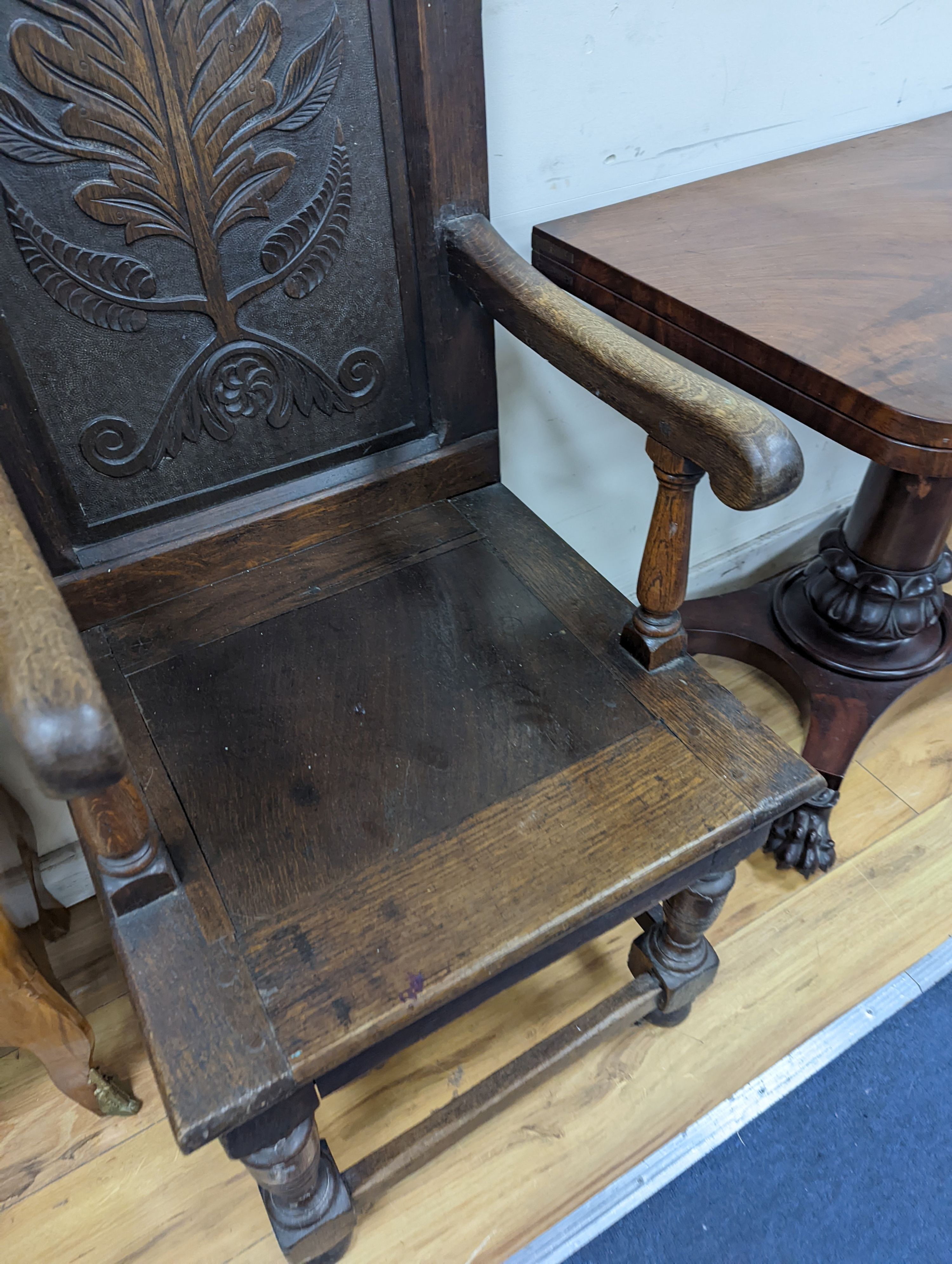 A 17th century style oak wainscot chair, width 54cm, height 122cm